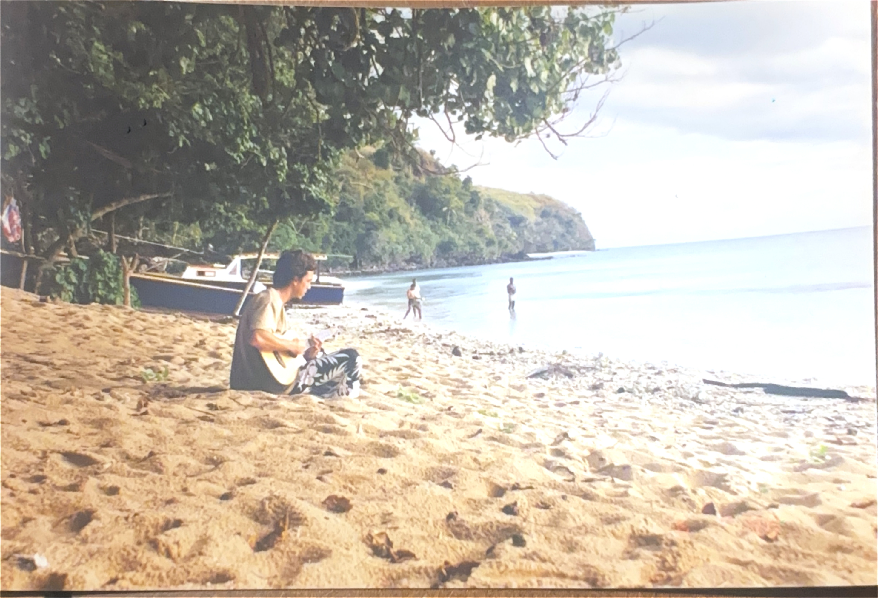Playing guitar on a tropical beach